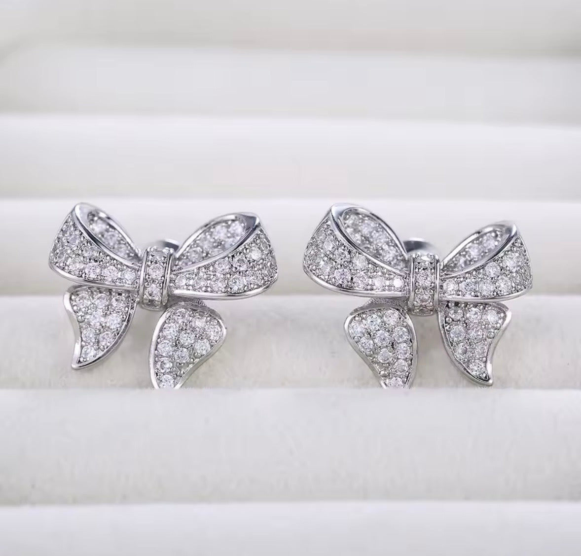 Silver bow earrings