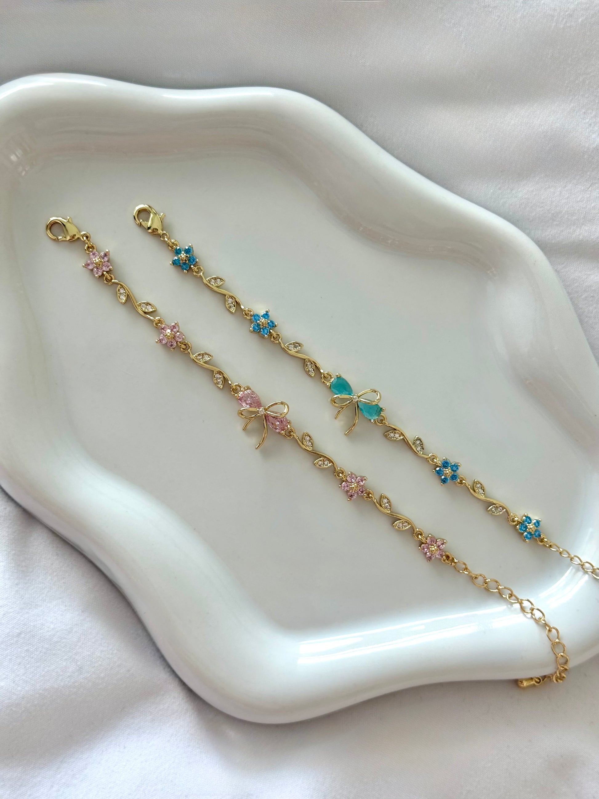 Floral bow charm bracelet