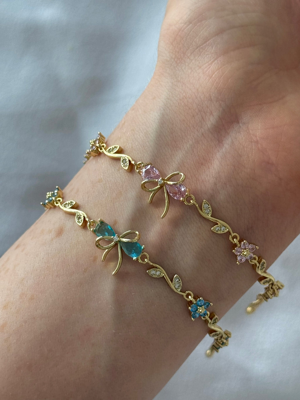 Floral bow charm bracelet